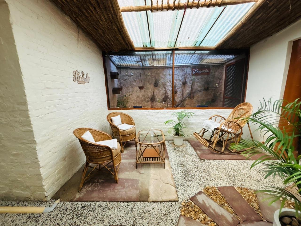 Cane seating in Bageecha's whitewashed courtyard